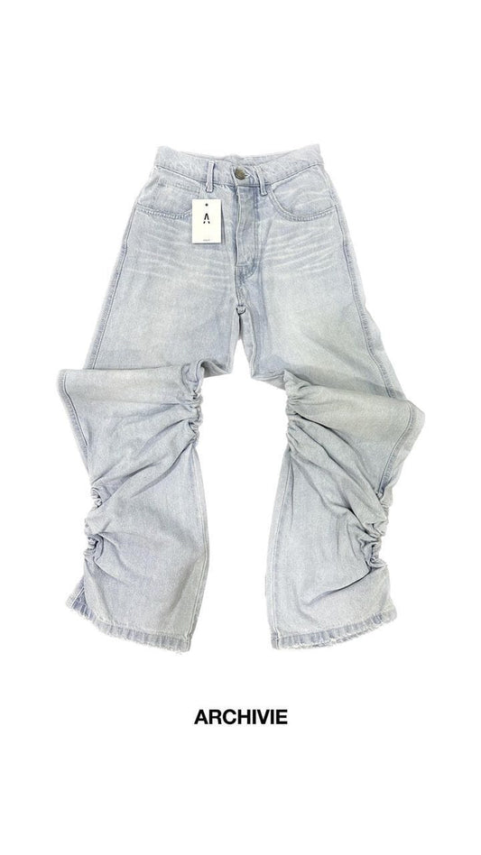 Jeans con arricciature laterali lavaggio chiaro