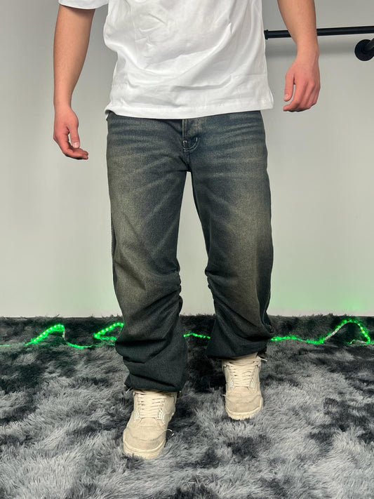 Jeans con arricciature laterali lavaggio scuro